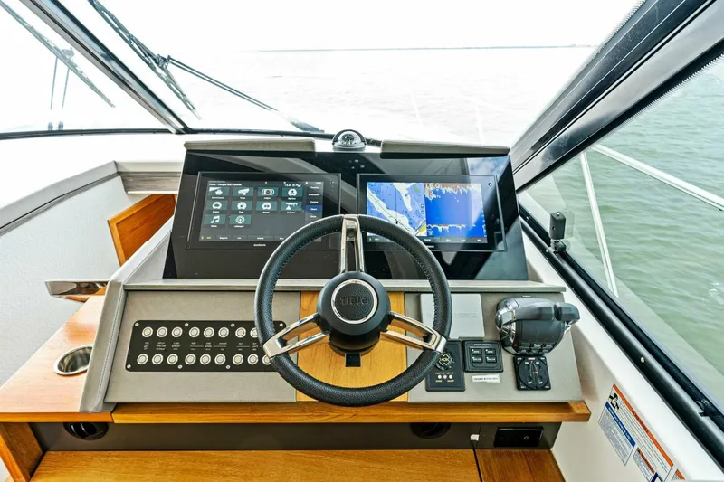 Victory Yacht Photos Pics Helm station of 2019 Tiara Yachts 49 COUPE with advanced navigation systems.