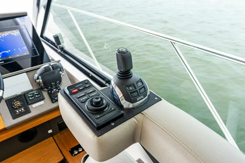 Victory Yacht Photos Pics 2019 Tiara Yachts 49 COUPE helm controls with joystick and navigation system.