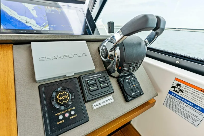 Victory Yacht Photos Pics Control panel of a 2019 Tiara Yachts 49 Coupe with Seakeeper and navigation system.