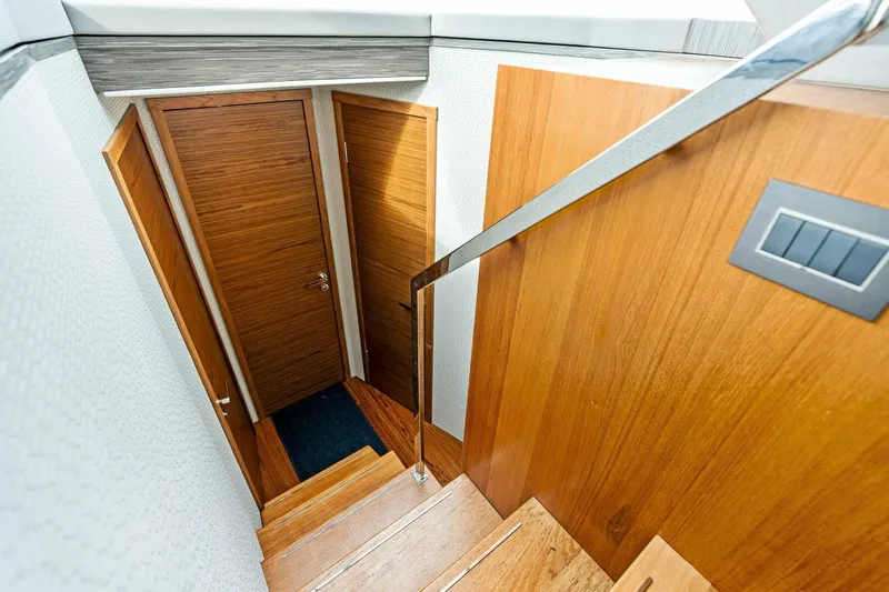Victory Yacht Photos Pics Staircase and wooden doors inside a 2019 Tiara Yachts 49 COUPE.