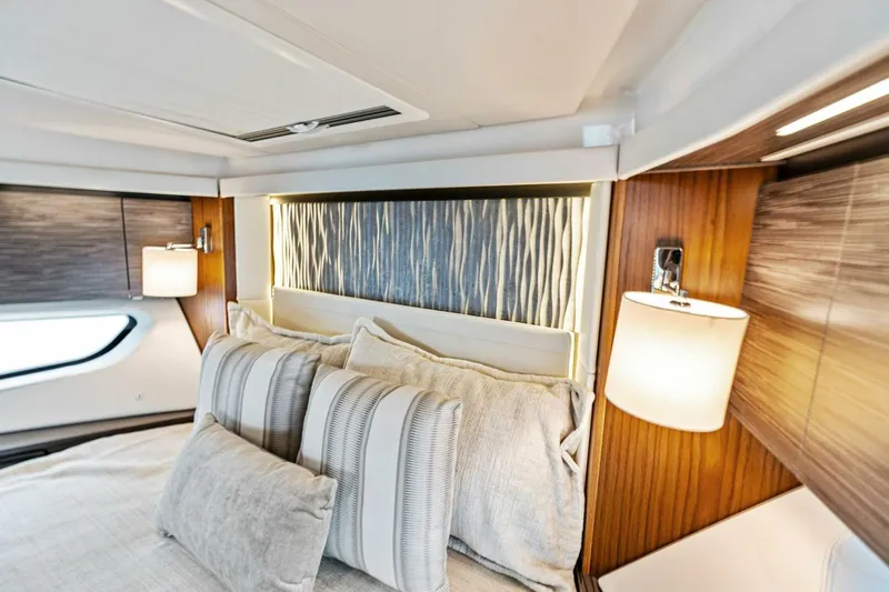 Victory Yacht Photos Pics Luxurious bedroom interior of 2019 Tiara Yachts 49 COUPE with modern lighting and elegant decor.