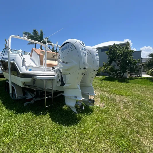  Yacht Photos Pics 2005 Formula 330 SS boat with twin Yamaha outboard engines on a trailer.