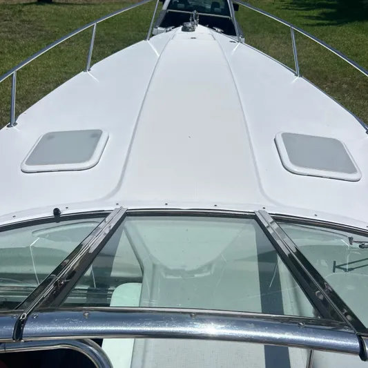  Yacht Photos Pics 2005 Formula 330 SS boat deck with sleek design and dual hatches.