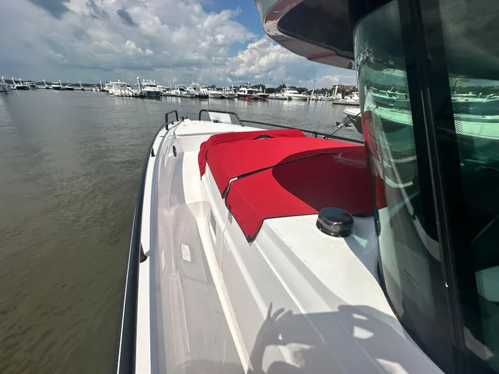 Rachel's Glory Yacht Photos Pics 2022 Axopar 37 XC Cross Cabin BRABUS LINE boat docked, featuring red seating and sleek design.
