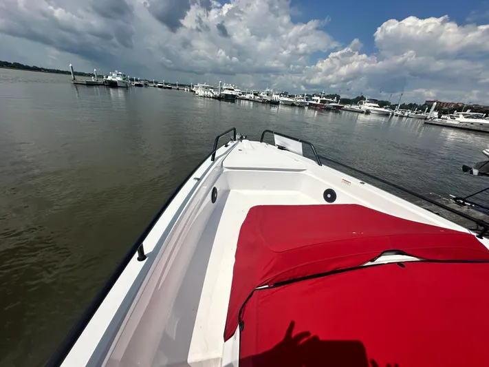 Rachel's Glory Yacht Photos Pics 2022 Axopar 37 XC Cross Cabin BRABUS LINE on calm waters, featuring a red cushioned deck.