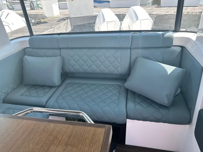 Rachel's Glory Yacht Photos Pics Luxurious seating in 2022 Axopar 37 XC Cross Cabin BRABUS LINE boat interior.