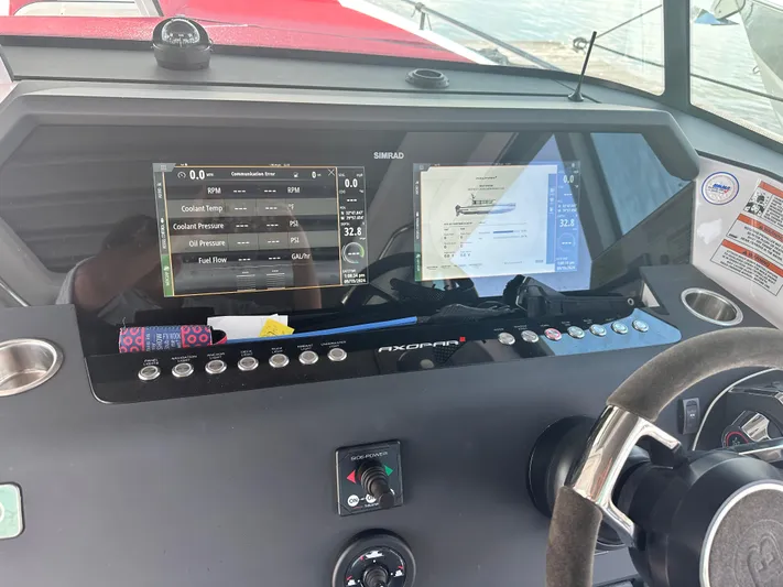 Rachel's Glory Yacht Photos Pics Dashboard of 2022 Axopar 37 XC Cross Cabin BRABUS LINE with navigation screens and controls.