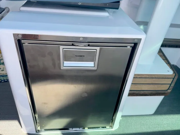 Rachel's Glory Yacht Photos Pics Stainless steel refrigerator on 2022 Axopar 37 XC Cross Cabin BRABUS LINE boat.