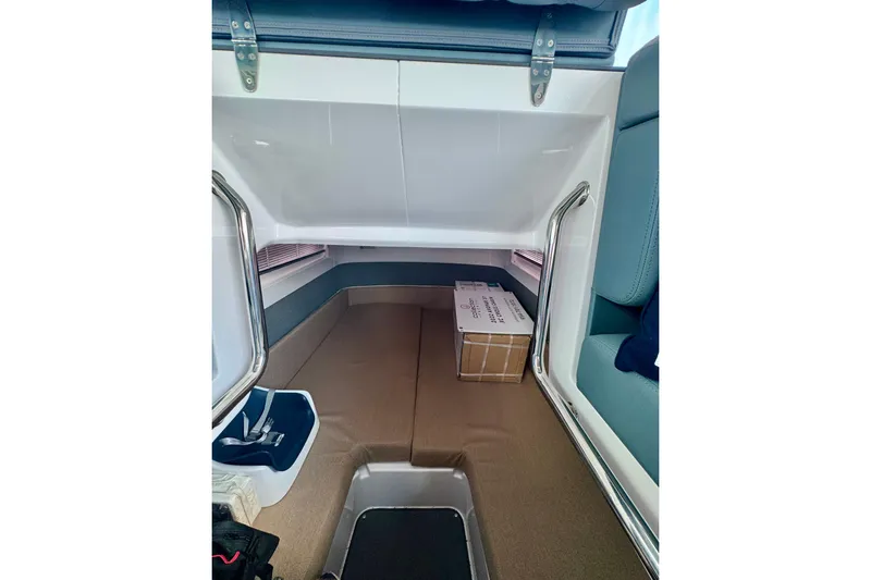 Rachel's Glory Yacht Photos Pics Interior cabin of 2022 Axopar 37 XC CROSS CABIN with seating and storage.