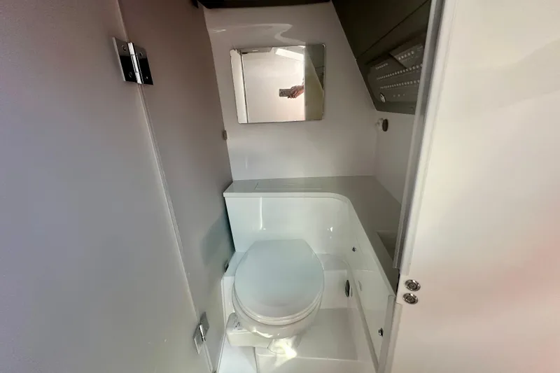 Rachel's Glory Yacht Photos Pics 2022 Axopar 37 XC CROSS CABIN bathroom with modern fixtures and compact design.