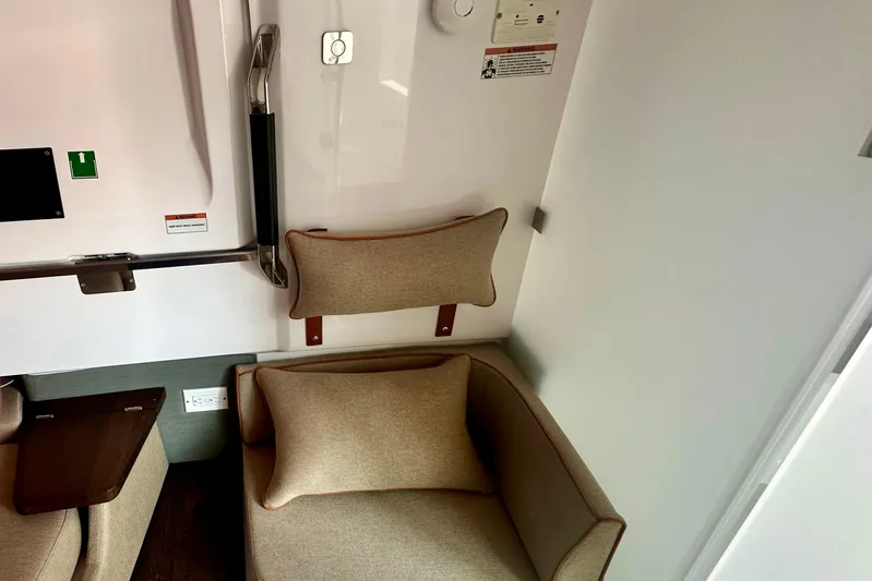 Rachel's Glory Yacht Photos Pics Interior of 2022 Axopar 37 XC CROSS CABIN with beige seating and modern design elements.