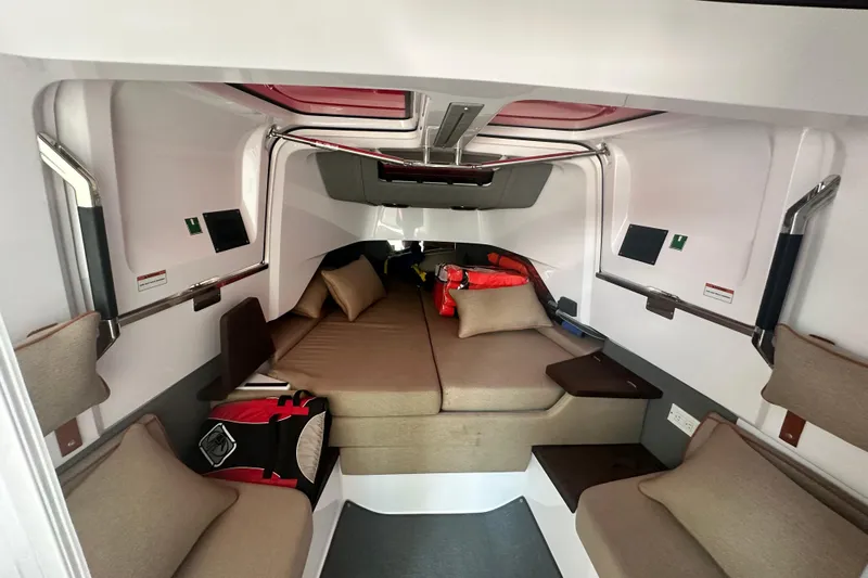 Rachel's Glory Yacht Photos Pics 2022 Axopar 37 XC CROSS CABIN interior with cozy seating and modern design.