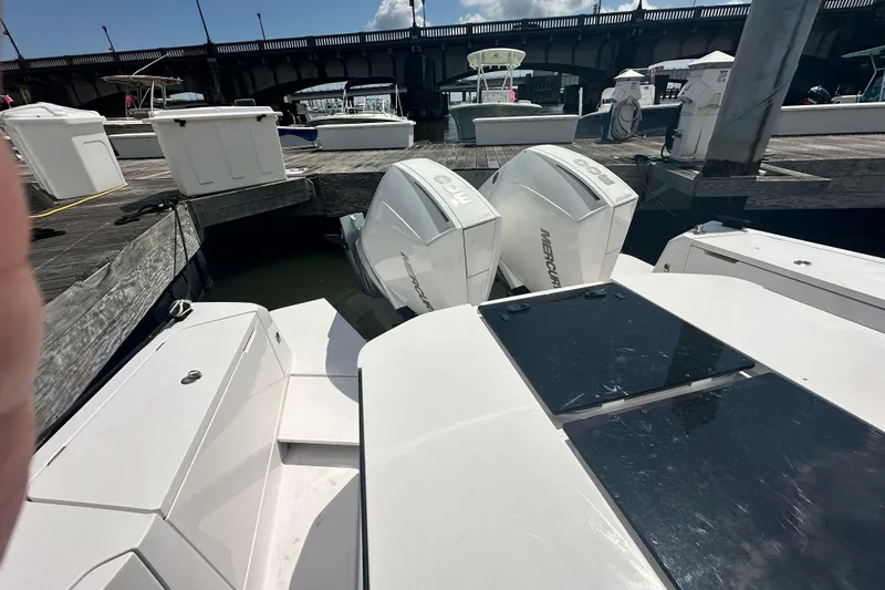 Rachel's Glory Yacht Photos Pics 2022 Axopar 37 XC CROSS CABIN with twin Mercury engines docked at marina.