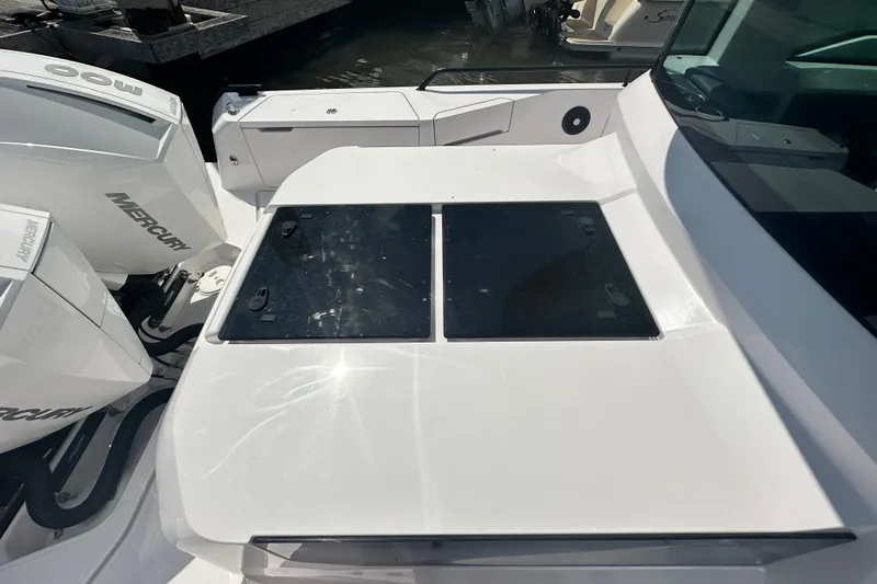 Rachel's Glory Yacht Photos Pics 2022 Axopar 37 XC CROSS CABIN boat with Mercury engines, docked in sunlight.