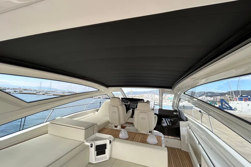  Yacht Photos Pics Interior view of 2023 Cranchi 60 ST yacht, featuring luxurious seating and panoramic windows.