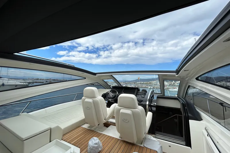  Yacht Photos Pics Luxurious 2023 Cranchi 60 ST yacht interior with panoramic views and elegant seating.