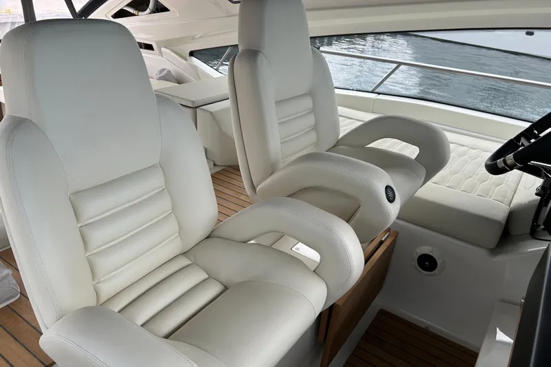  Yacht Photos Pics Luxurious interior of 2023 Cranchi 60 ST yacht with plush white seating.