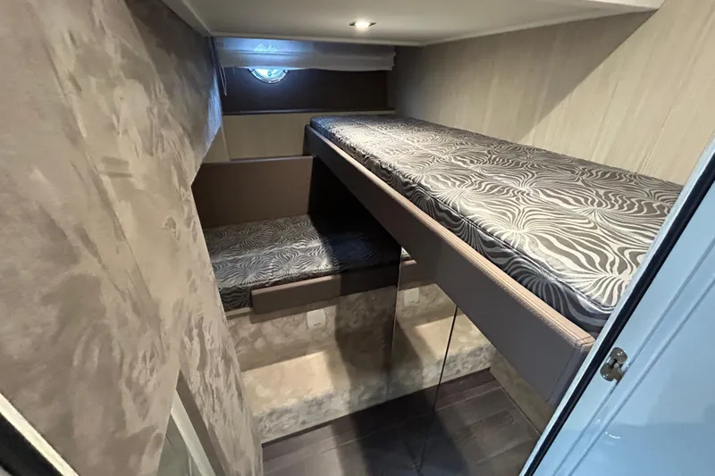  Yacht Photos Pics 2023 Cranchi 60 ST yacht interior with stylish bunk beds and modern design.