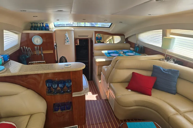 Mojito Yacht Photos Pics Luxurious 2004 Sea Ray 480 Motor Yacht interior with elegant seating and dining area.