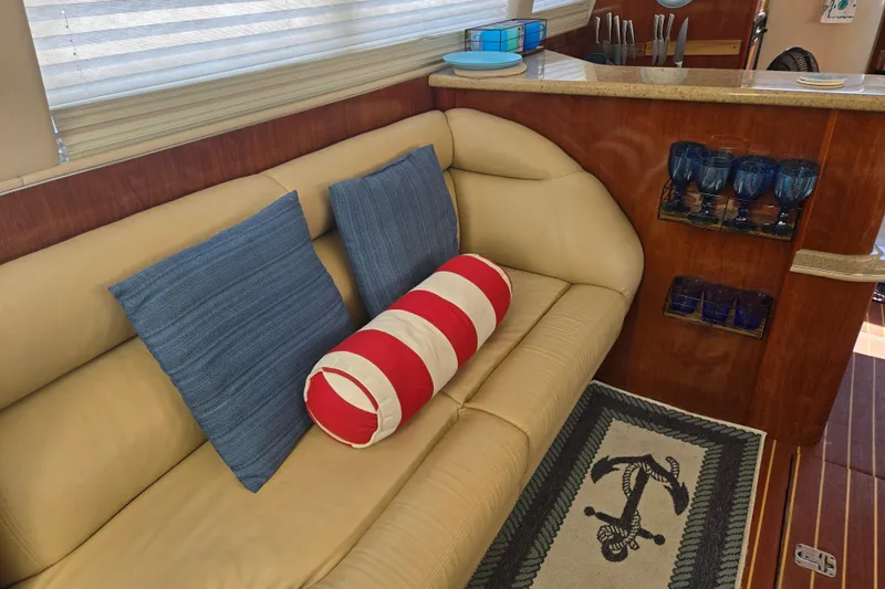 Mojito Yacht Photos Pics Luxurious interior of 2004 Sea Ray 480 Motor Yacht with cozy seating and nautical decor.