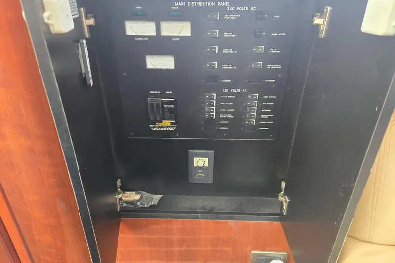 Mojito Yacht Photos Pics Electrical panel inside 2004 Sea Ray 480 Motor Yacht, featuring various switches and controls.