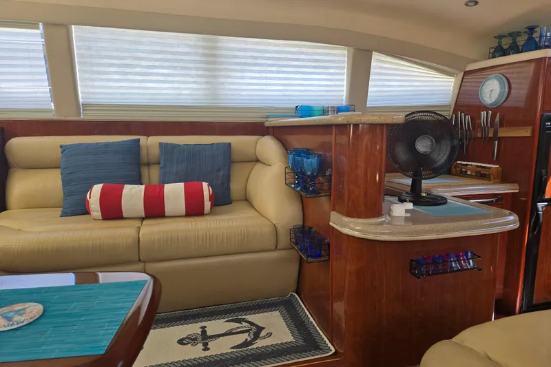Mojito Yacht Photos Pics Luxurious interior of 2004 Sea Ray 480 Motor Yacht with plush seating and nautical decor.