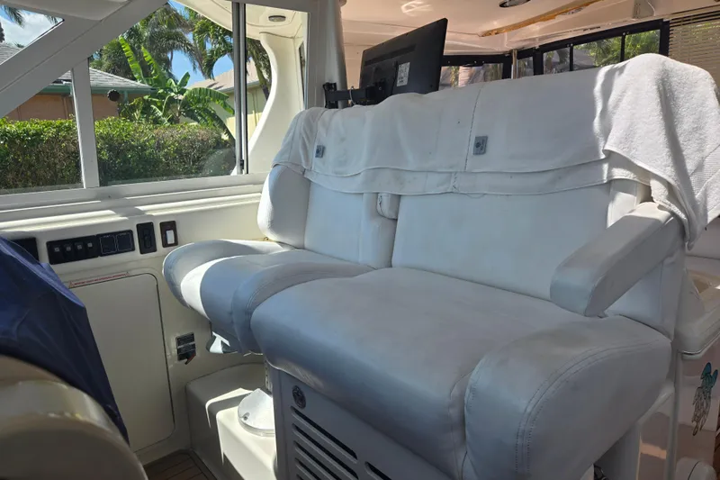 Mojito Yacht Photos Pics Luxurious interior seating of 2004 Sea Ray 480 Motor Yacht with white upholstery.