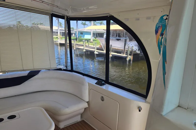 Mojito Yacht Photos Pics Interior of 2004 Sea Ray 480 Motor Yacht with waterfront view and parrot decor.