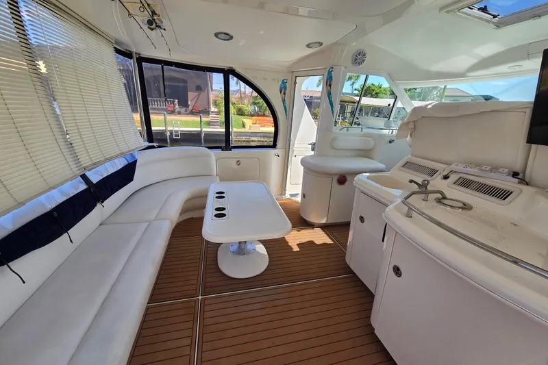 Mojito Yacht Photos Pics Luxurious interior of 2004 Sea Ray 480 Motor Yacht with elegant seating and modern amenities.