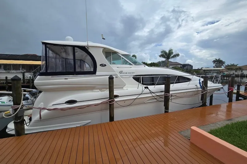 Mojito Yacht Photos Pics 2004 Sea Ray 480 Motor Yacht docked, showcasing sleek design and spacious cabin.