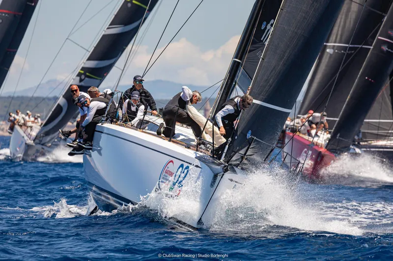  Yacht Photos Pics Sailing race featuring 2016 Nautor Swan ClubSwan 50 yachts on vibrant blue waters.