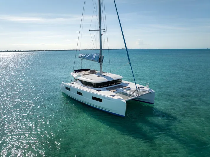Watercolor Yacht Photos Pics 2023 Lagoon 46 catamaran sailing on clear turquoise waters under a sunny sky.