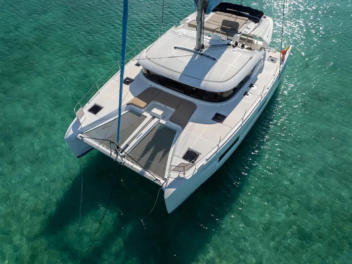 Watercolor Yacht Photos Pics 2023 Lagoon 46 catamaran sailing on clear turquoise waters.