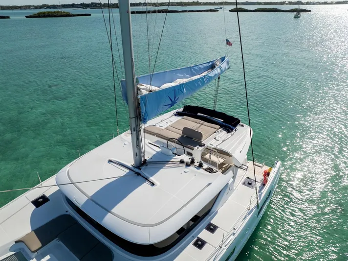 Watercolor Yacht Photos Pics 2023 Lagoon 46 catamaran sailing on clear turquoise waters.