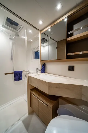 Watercolor Yacht Photos Pics Modern bathroom in 2023 Lagoon 46 yacht with sleek design and ample storage.