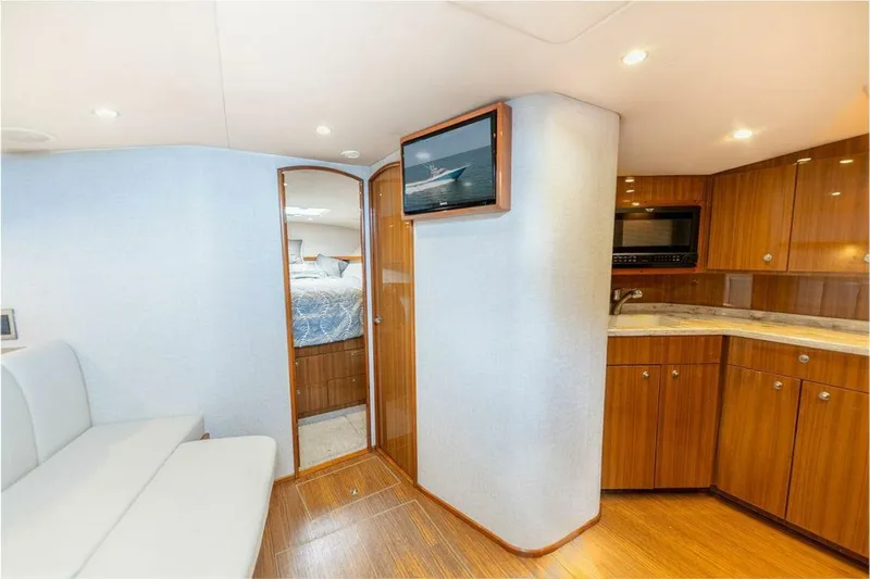 Miss Peggy Sue II Yacht Photos Pics Interior of 2018 Viking 44 Open yacht with modern kitchen and cozy seating area.
