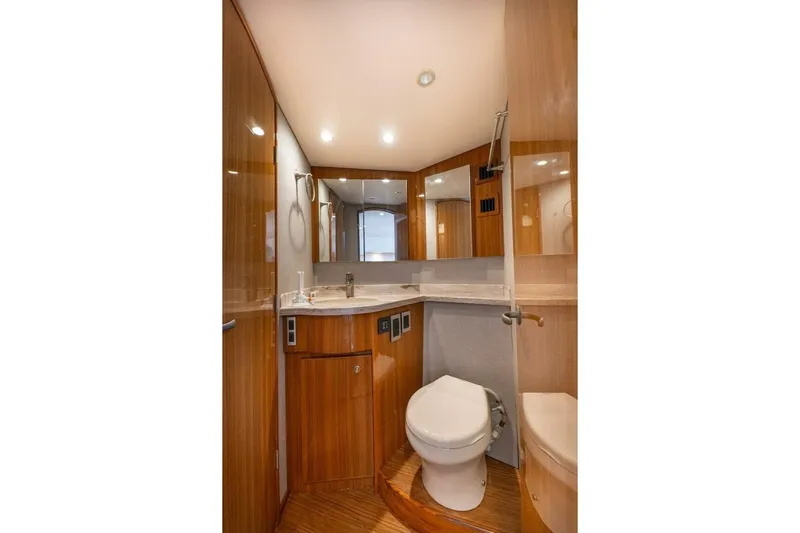 Miss Peggy Sue II Yacht Photos Pics Luxurious bathroom in 2018 Viking 44 Open yacht with modern fixtures and wood accents.