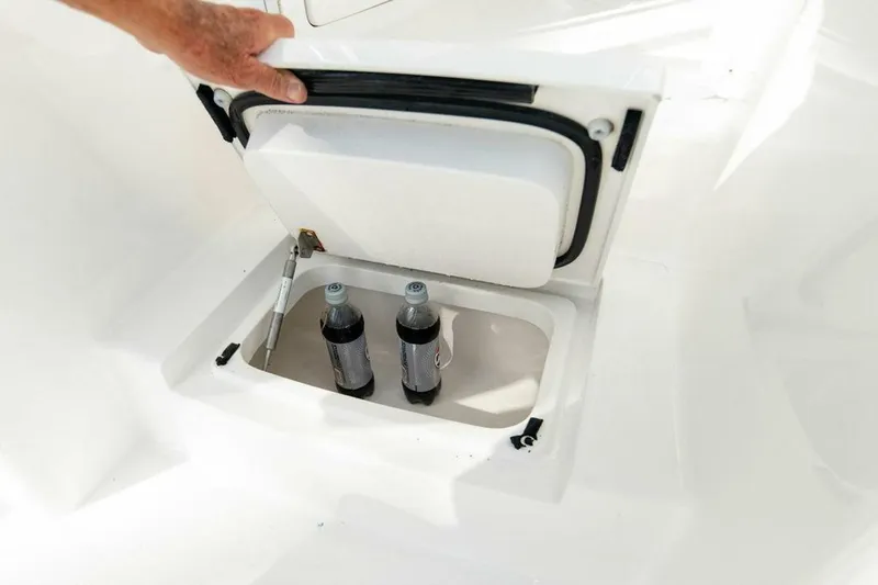 Miss Peggy Sue II Yacht Photos Pics Storage compartment on 2018 Viking 44 Open boat with two bottles inside.