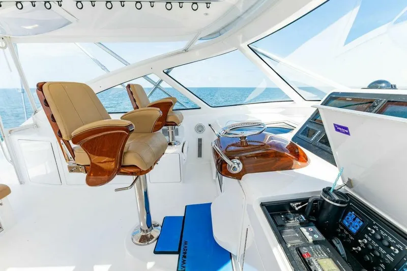 Miss Peggy Sue II Yacht Photos Pics Luxurious helm of 2018 Viking 44 Open yacht with leather seats and ocean view.