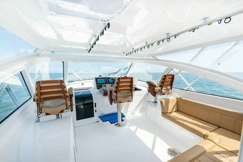 Miss Peggy Sue II Yacht Photos Pics Luxurious interior of 2018 Viking 44 Open yacht with helm and seating area.