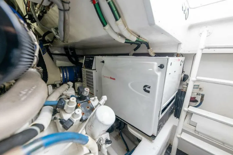 Miss Peggy Sue II Yacht Photos Pics Engine room of 2018 Viking 44 Open with Cummins Onan generator.