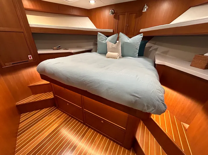 Novia II Yacht Photos Pics Luxurious cabin interior of 2020 Marlow Explorer 66E yacht with cozy bedding.