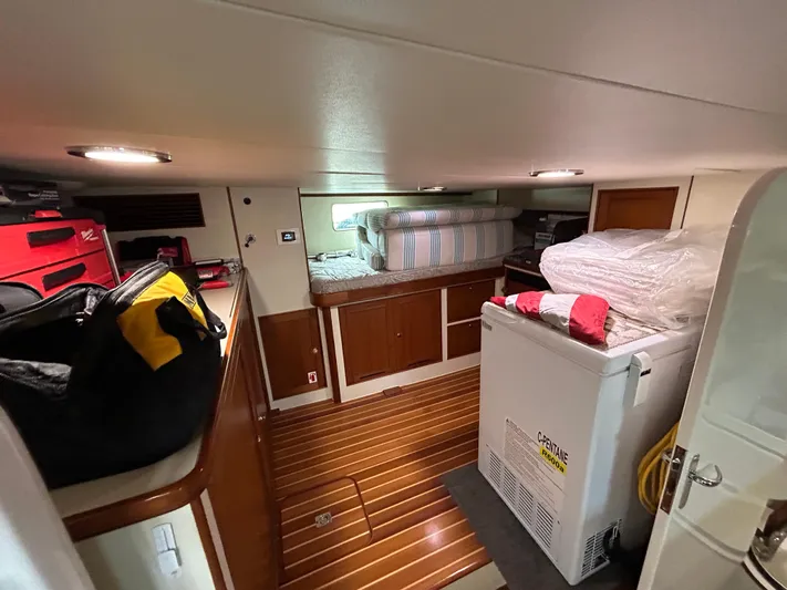 Novia II Yacht Photos Pics Interior of 2020 Marlow Explorer 66E yacht with wooden flooring and storage.