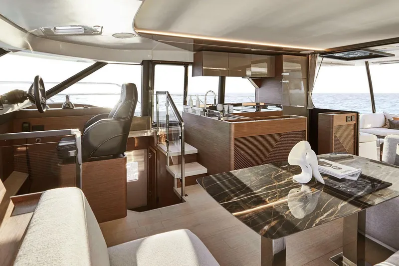 M3400 Yacht Photos Pics Manufacturer Provided Image: Luxurious interior of 2025 Prestige M48 yacht with modern kitchen and seating area.