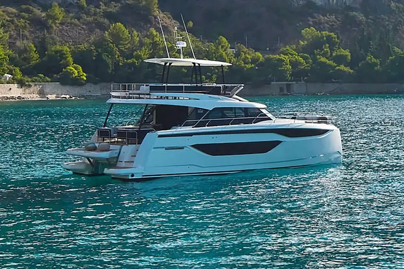 M3400 Yacht Photos Pics Manufacturer Provided Image: Luxury 2025 Prestige M48 yacht on serene turquoise waters.