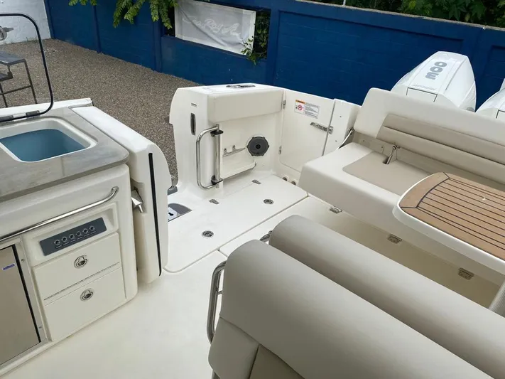 2023 Boston Whaler 320vantage @ Puerto Vallarta Yacht Photos Pics Interior of 2023 Boston Whaler 320 Vantage with seating and sink area.