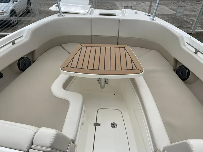 2023 Boston Whaler 320vantage @ Puerto Vallarta Yacht Photos Pics Interior of 2023 Boston Whaler 320 Vantage with table and seating area.