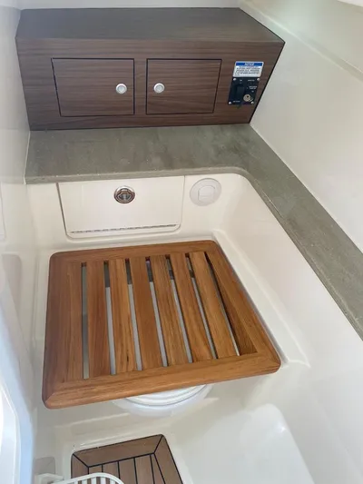 2023 Boston Whaler 320vantage @ Puerto Vallarta Yacht Photos Pics Interior of 2023 Boston Whaler 320 Vantage with wood accents.