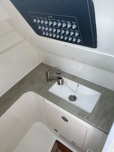2023 Boston Whaler 320vantage @ Puerto Vallarta Yacht Photos Pics Interior of 2023 Boston Whaler 320 Vantage with sink and fixtures.