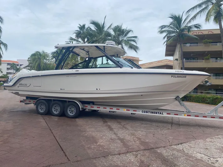 2023 Boston Whaler 320vantage @ Puerto Vallarta Yacht Photos Pics 2023 Boston Whaler 320 Vantage on trailer, palm trees in background.